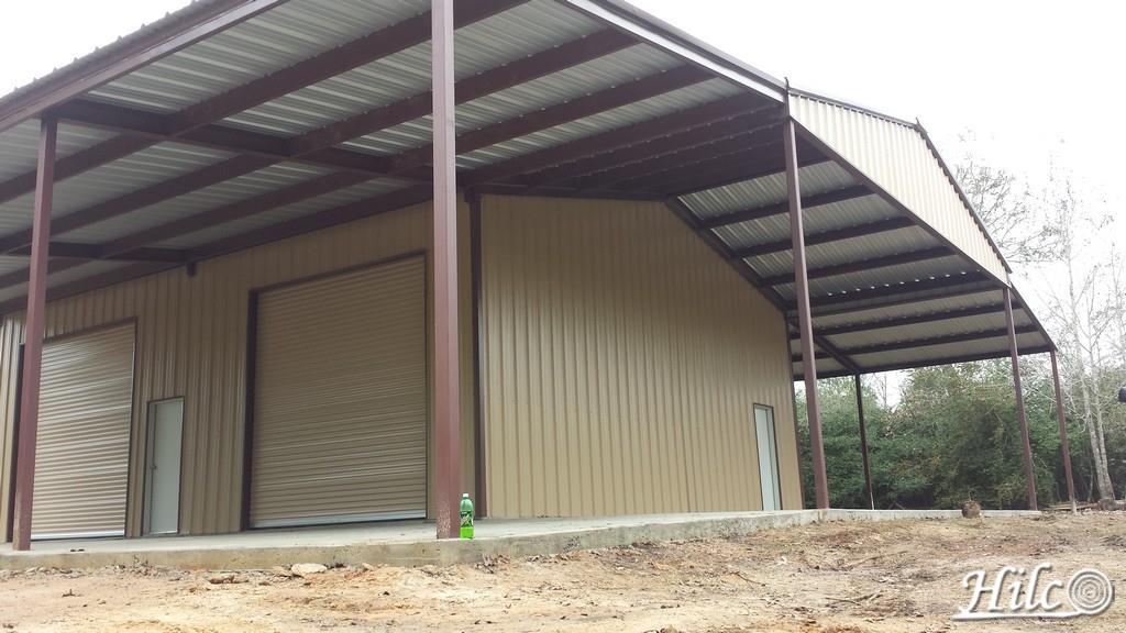 Barndominium with large roll-up garage doors